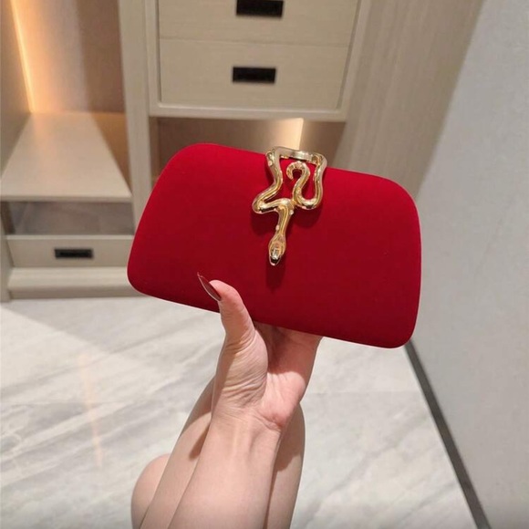 Elegant Red Clutch with Gold Snake Design  Accent